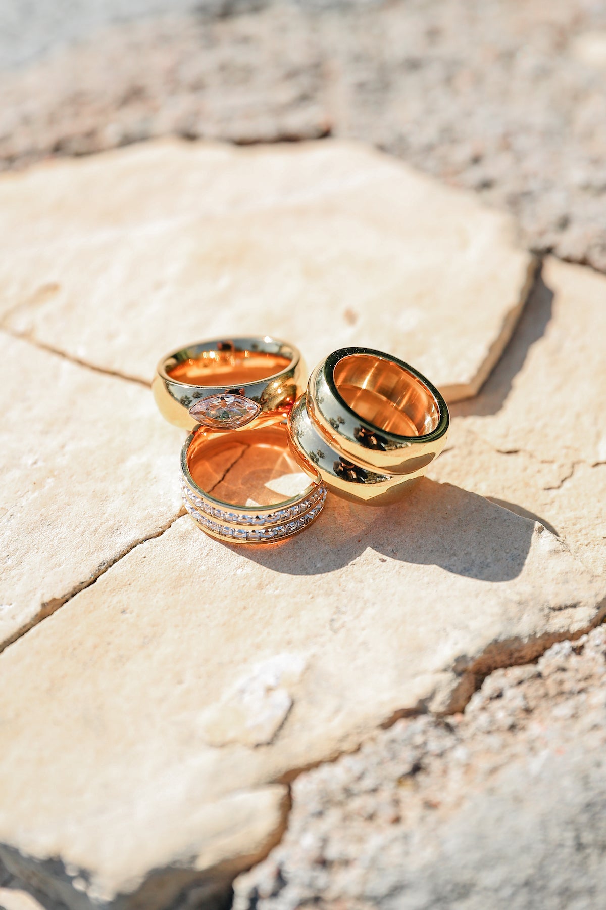 Goals Ring stacked on stone backdrop with Be Extra ring & Spotlight ring