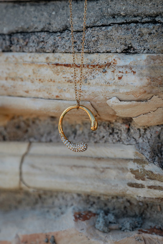 Time to shine necklace against a stone backdrop
