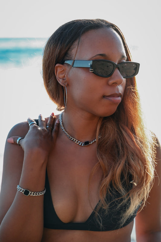 Model wearing onyx necklace and onyx bracelet