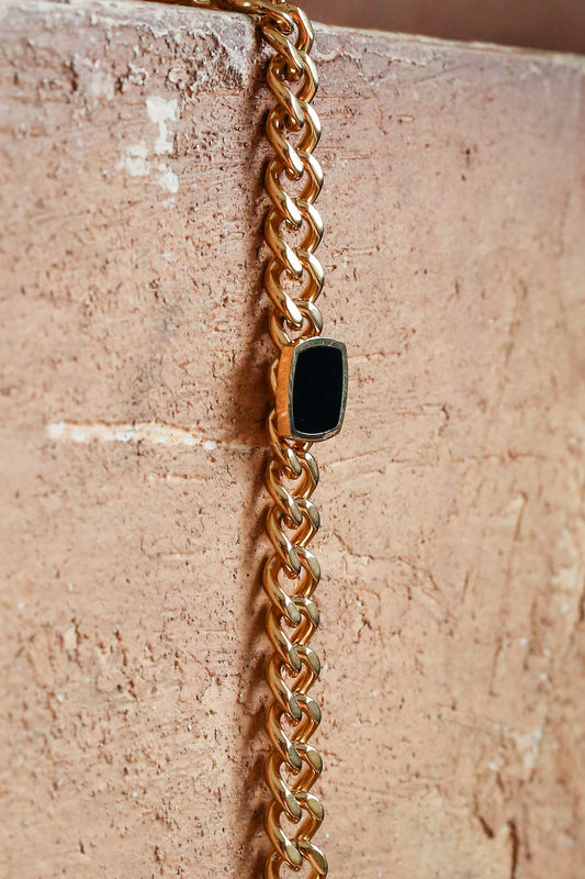 Onyx Bracelet laying flat down a wall