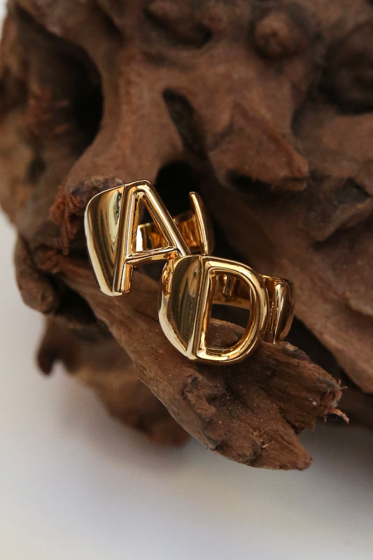 14k Gold AD ring set. A and D open banded ring on wood
