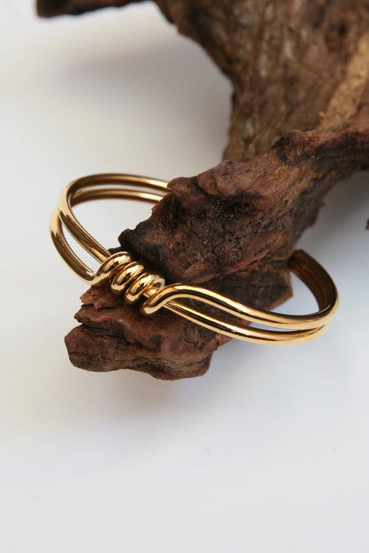 Two banded Gold  surrounded bracelet with a front wrap around detail 