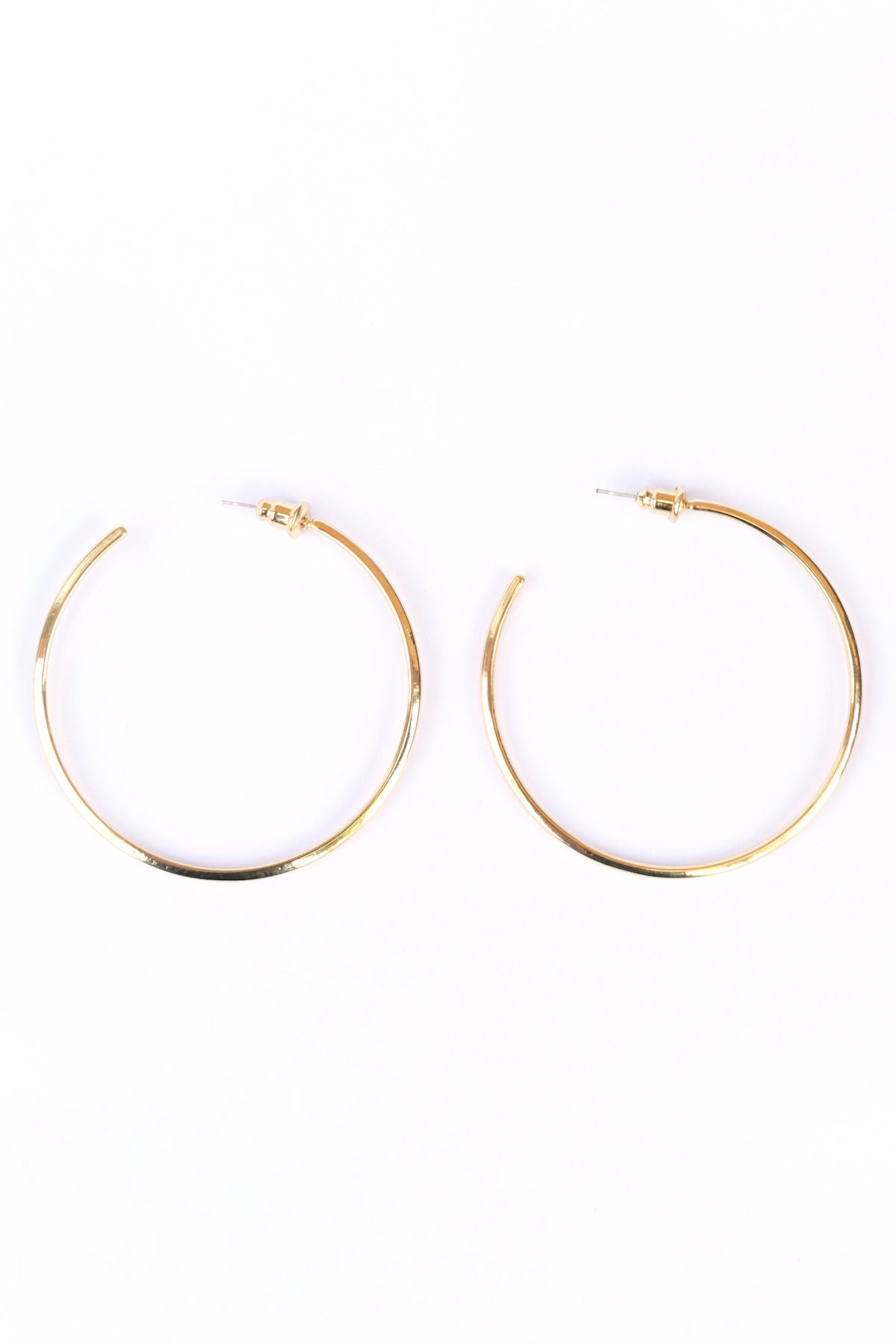Gold Modern hoop earrings on a white backdrop