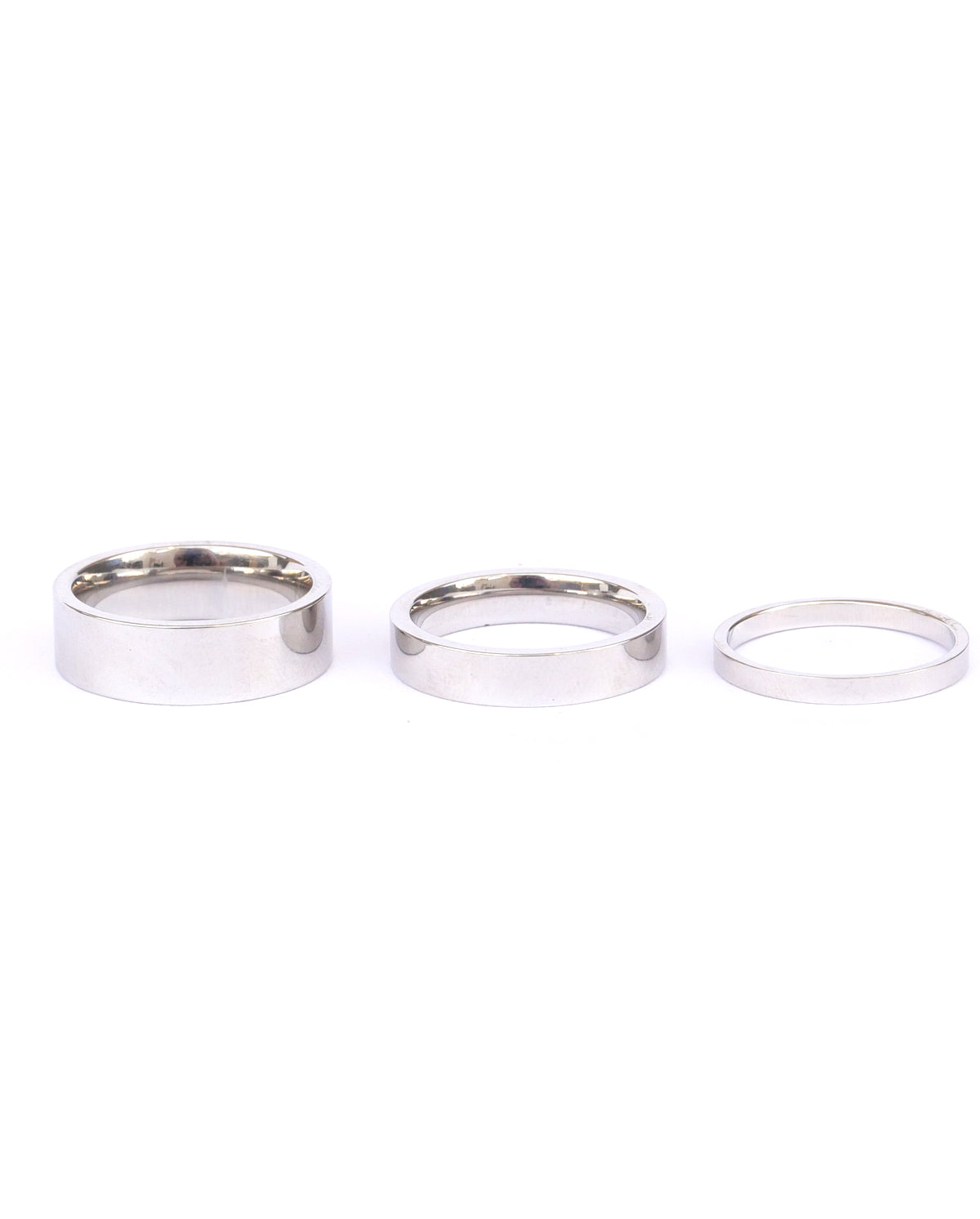 Silver banded Amor ring set on a white backdrop showing different widths of rings